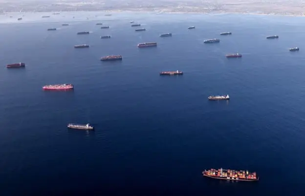 shipping container boats across the water