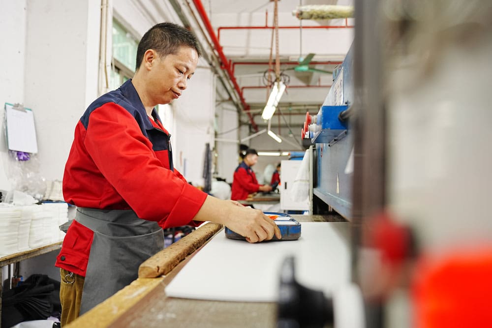 man working with a mold in a factory